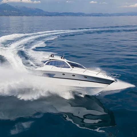 Motor yacht carving through open water