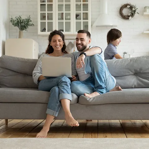 Family relaxing together on a sofa
