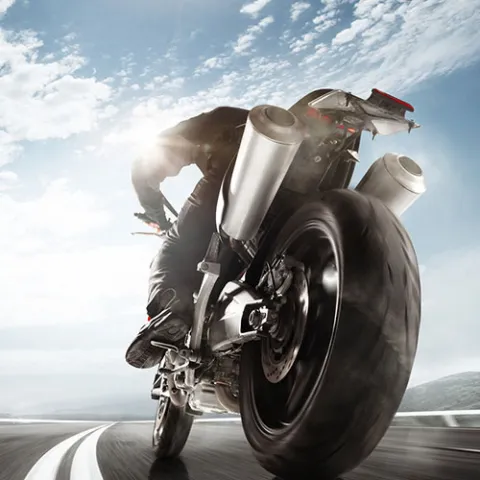 Motorcyclist leaning into a turn
